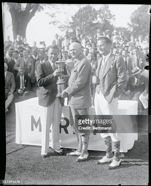 Merian Cricket Club, Philadelphia. Bobby Jones receives U.S. Amatuer trophy from Findlay Douglas, President Eugene Homans, right.