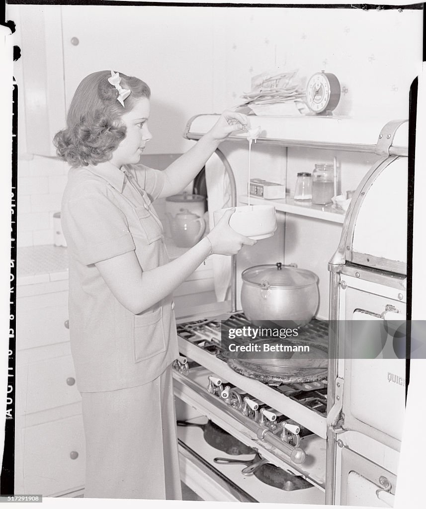 Judy Garland Cooking at Stove