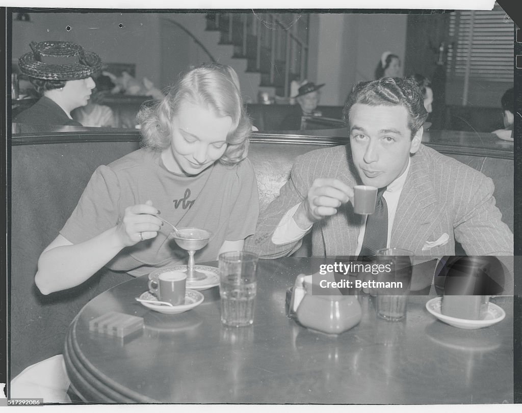 Virginia Bruce and Pat Di Cicco at Restaurant Table