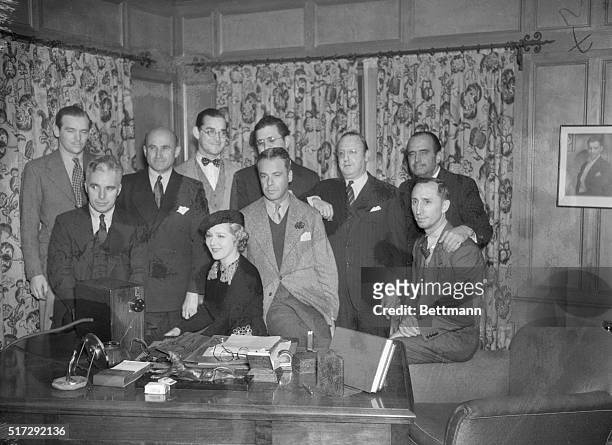 Hollywood Moguls Meet. As members of the United Artists, Mary Pickford and Douglas Fairbanks, met recently in the office of Samuel Goldwyn. Pictured...