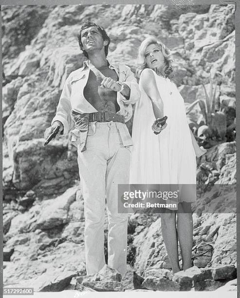 Terence Stamp and Monica Vitti in a scene from the movie: "Modesty Blaise." March 1966. Movie still.