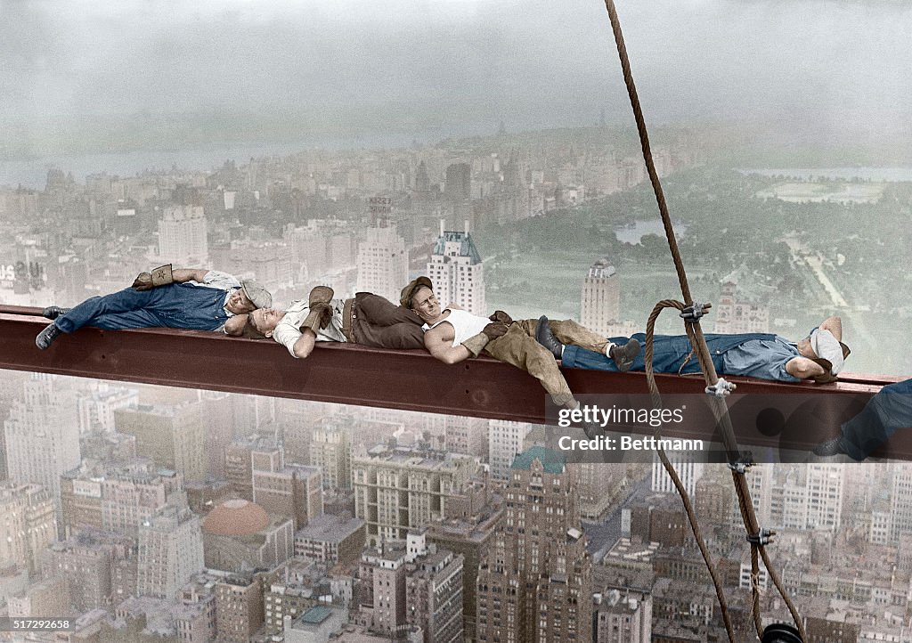 Construction Workers Resting on Steel Beam Above Manhattan