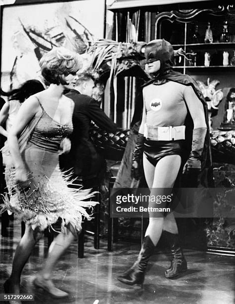 Adam West in the famously campy TV series "Batman", during one of the shows first episodes in February 1966. Here the Caped Crusader faces one of the...