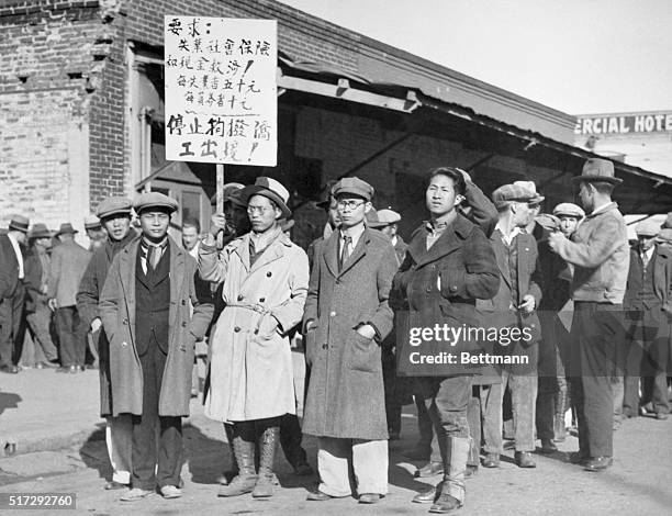 Sacramento, CA: A Chinese section in the hunger parade at Sacramento, CA, to present demands to the state legistlature had its own banner in the...