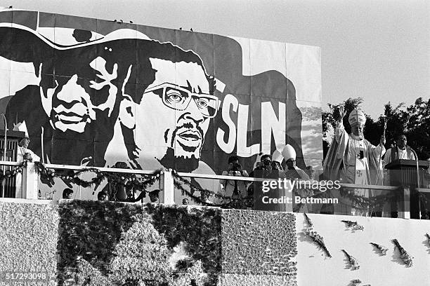 Managua, Nicaragua- Pope John Paul II celebrates mass at the July 19th Plaza here 3/4, under a giant mural of Sandina, a revolutionary here, and...