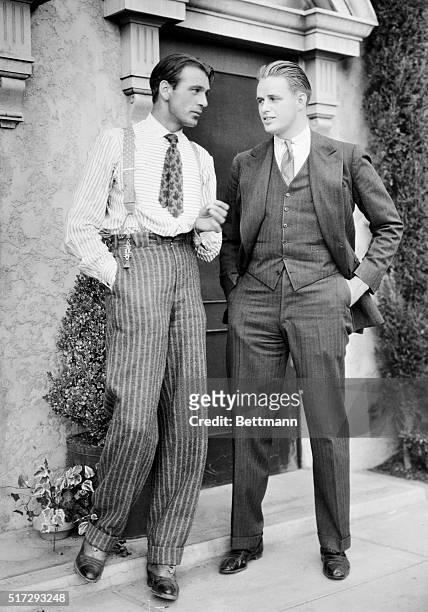 Roosevelt in Hollywood: Elliott Roosevelt, son of the president, chats with Gary Cooper on the Paramount lot while Gary waits outside his dressing...