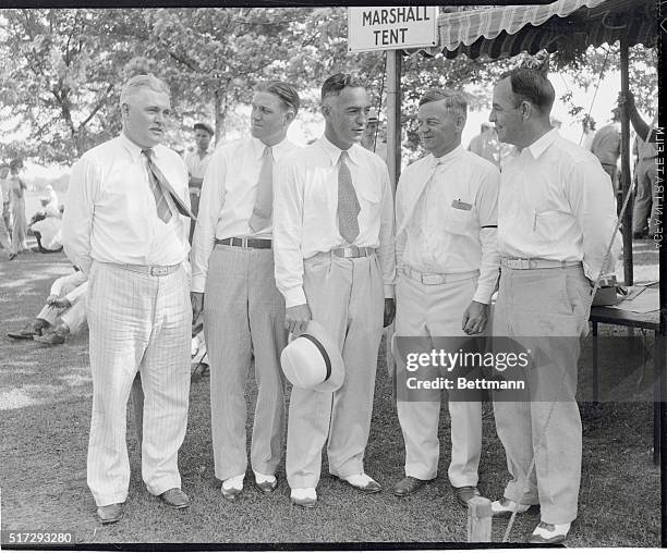 College Coaches at Golf Classic. Near Chicago, Illinois: Five prominent college coaches as they acted as scorers and marshals during the 1933...