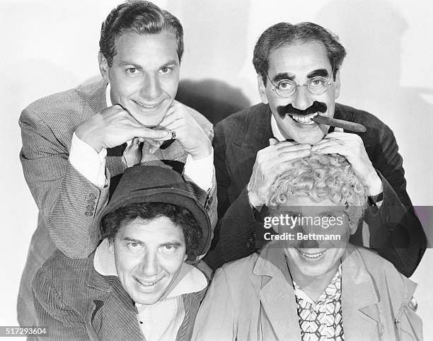 The Marx Brothers assume their roles from the movie Duck Soup. Clockwise from top left are: Zeppo Marx as Lt. Bob Roland, Groucho Marx as Rufus T....
