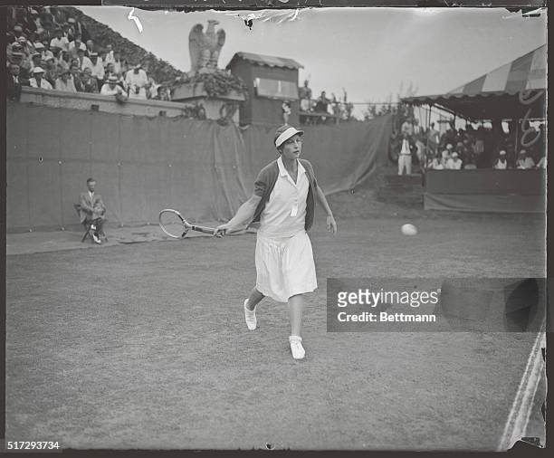 Mrs. Helen Wills Moody, California's great gift to the tennis world, shown in action against Miss Mary Heeley of England during their match in the...