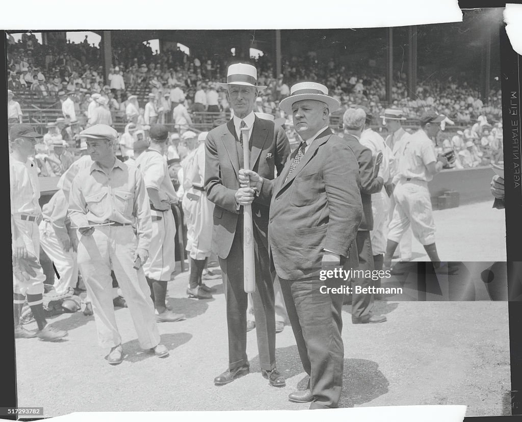 Men Holding Baseball Bat