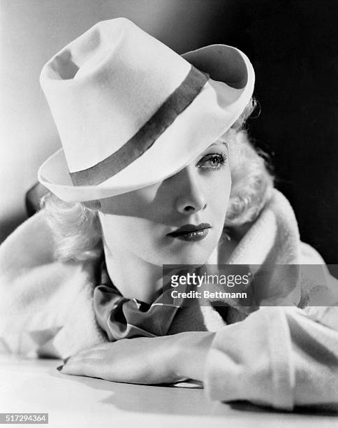 Lucille Ball, Warner Bros. Player, wears the "gondolier" hat, newest Hollywood fashion inspired by a Hollywood production, Top Hat, in which...