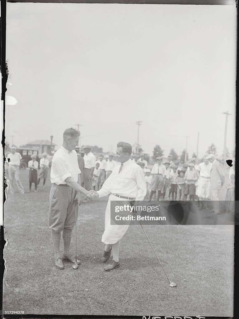 Golfing Competitors Shaking Hands on the Green