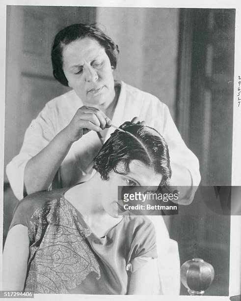 Common Garden Chalk Used by Movie Stars: Culver City, California: Photo shows Leatrice Joy having her hair chalked by a maid. Common chalk has been...