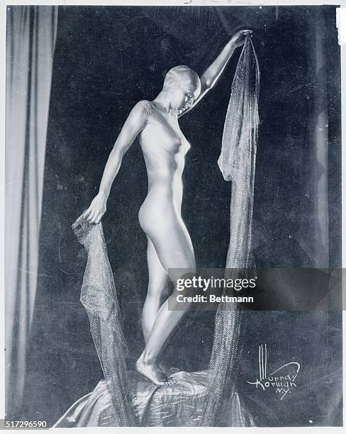 Pictured here in her dance costume of gilt, giving her the appearance of a golden statue, is Rosezelle Rowland - known as Rose Zell - who is reported...