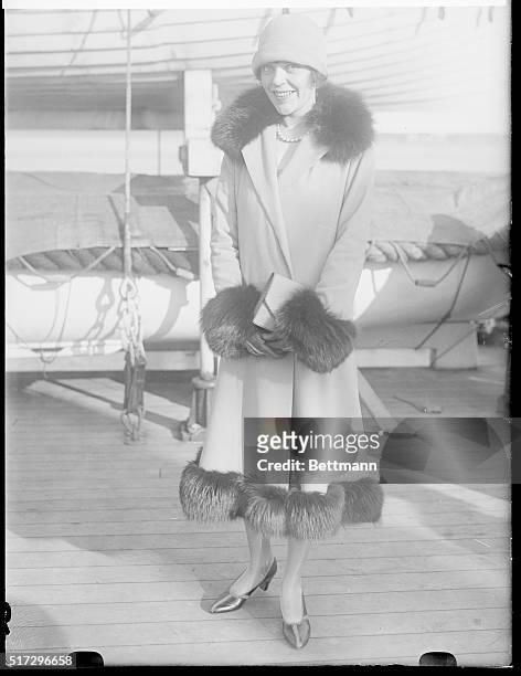 Photo shows Miss Marjorie Booth, former Broadway star, who supplied a demand when she established a novel information bureau for American tourists in...