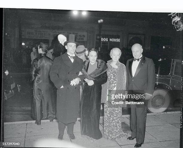 Erik Rhodes, Katherine Demille, Mrs. Cecil Demille, Cecil Demille, pictured , as they attended the premier of Modern Times at Grauman's Chinese...