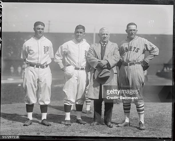 Left to right is captain Hack Wilson and manager Stuffy McInnis of the Philadelphia team and John McGraw and Rogers Hornsby, manager and captain of...
