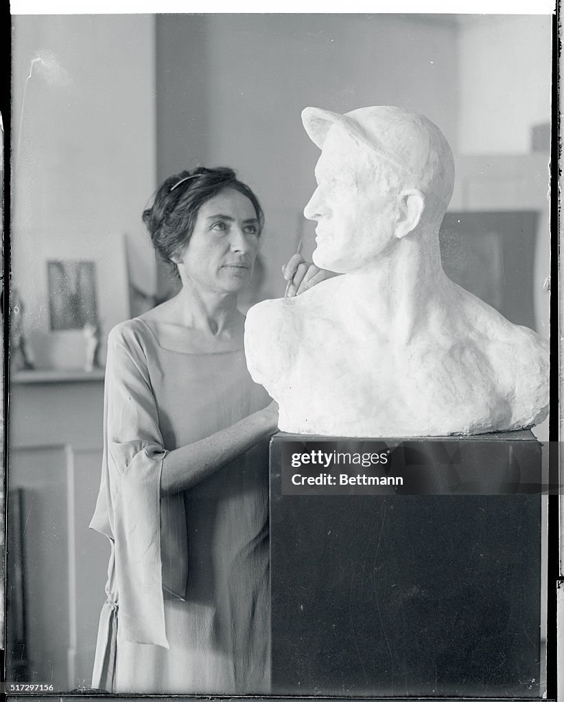 Gertrude Boyle Sculpting a Bust of Christy Mathewson