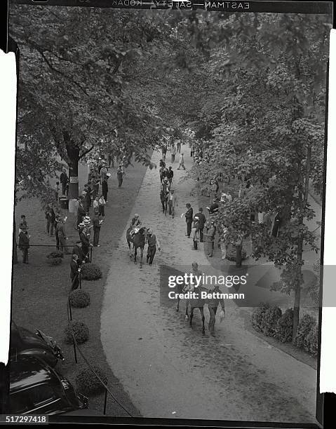 The horses going to the post for the first race at Saratoga is shown on the second day of the current season. The race was won by Happily by with Du...