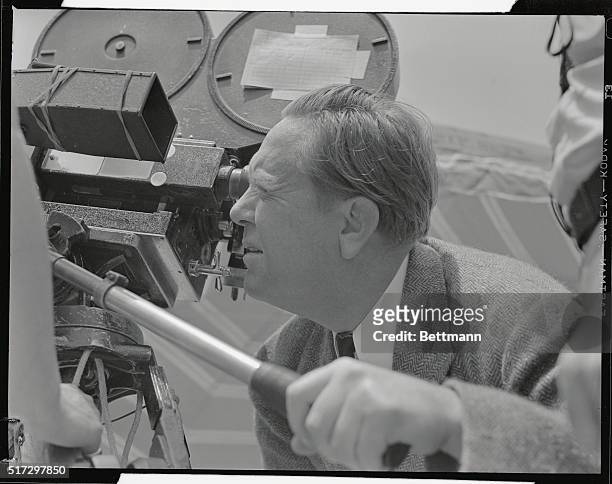 Director Robert Z. Leonard watches his camera angles carefully here. He is shown checking up on a scene with Jeanette MacDonald and Allan Jones in...