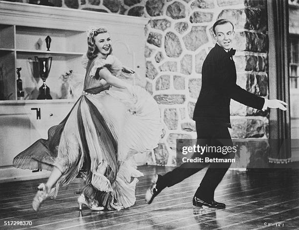 Dancing stars in "Yam" session. Hollywood, California...The King and Queen of Dance, Fred Astaire and Ginger Rogers, together again in Carefree, go...