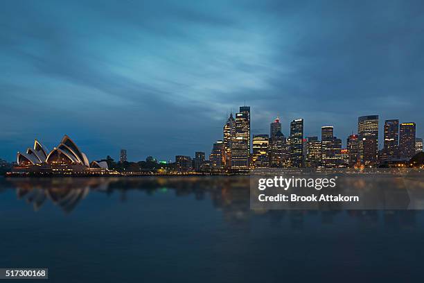 sydney harbour night time panorama viewed. - sydney at dusk ストックフォトと画像