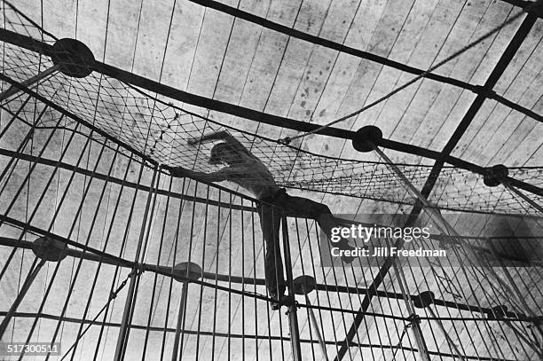 An acrobat in the safety net at the Clyde Beatty-Cole Bros. Circus show, USA, 1971.