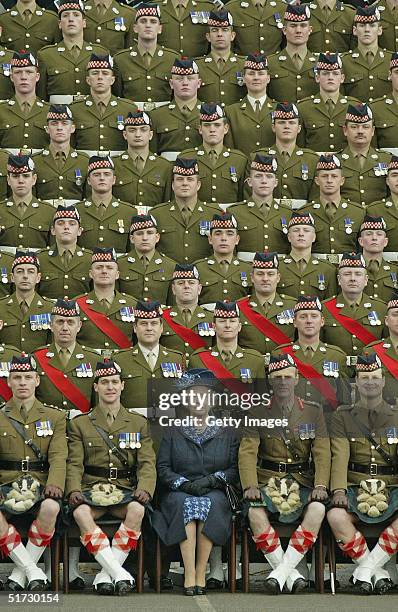 Queen Elizabeth II Britain's poses at Howe Barracks in Canterbury, Kent with the 1st Battalion of The Argyll and Sutherland Highlanders with the...