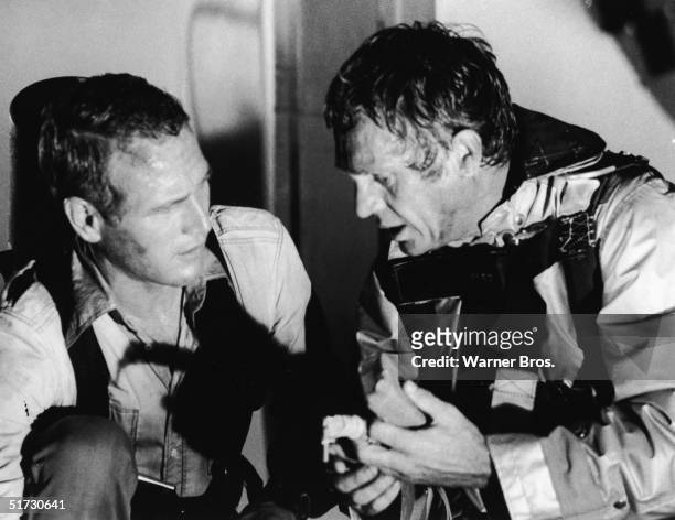 American actors Paul Newman and Steve McQueen in character as the architect Doug Roberts and the fire chief Michael O'Hallorhan respectively in a...