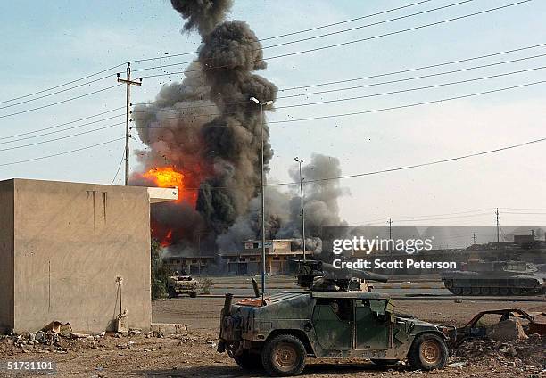 An explosion rips through downtown Fallujah, as U.S. Marines of the 1st Battalion 3rd Marines, prepare for and take on an Iraqi insurgent...