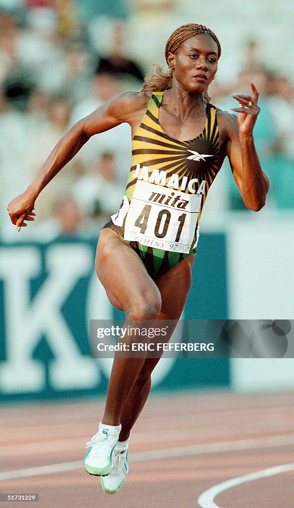 Merlene Ottey of Jamaica takes the curve during he