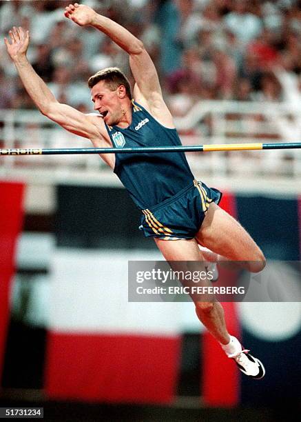 Sergei Bubka of the Ukraine reacts as he flies over the bar during the final of men's pole vault event at the Athens '97 World Athletics...