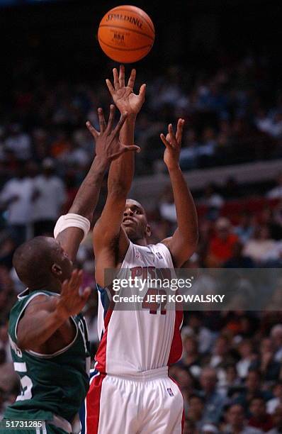 Detroit Pistons Jerry Stackhouse puts up a shot over Boston Celtics Eric Williams during the second half of the first game of the second round of the...