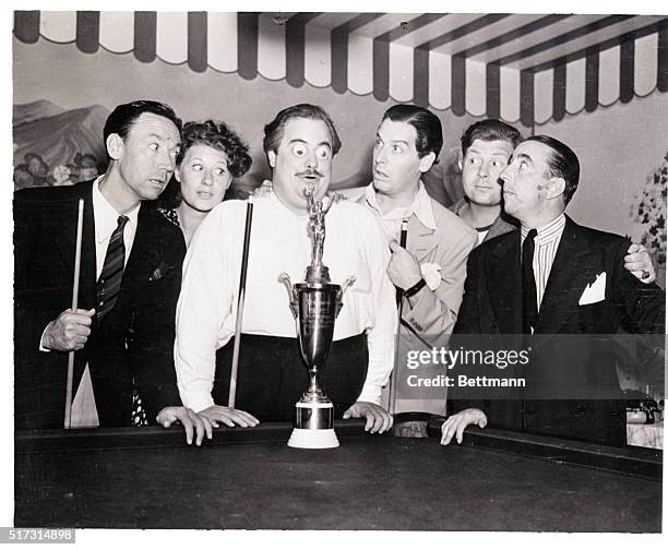 Hollywood, CA- Comedian Jack Smart's eyes are about to pop out as he regards the trophy donated by Milton Berle, sponsor of the film plays Pocket...