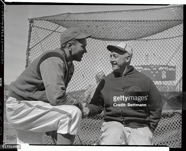 Jerome Herman Dean , the Chicago Cubs' latest six-figure investment, greets Frankie Frisch, manager of the St. Louis Cardinals, at Wrigley Field,...