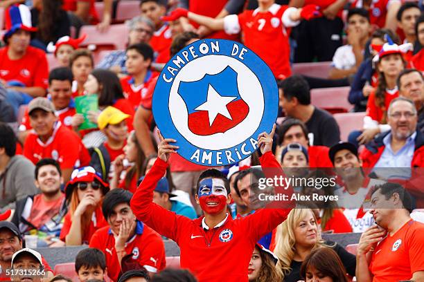 Fans of Chile cheer for their team prior to a match between Chile and Argentina as part of FIFA 2018 World Cup Qualifiers at Nacional Stadium on...