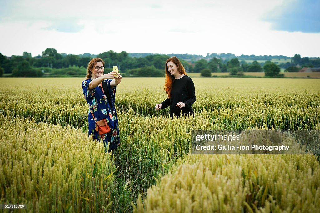 Two women in wheat field