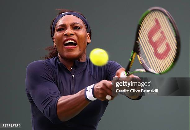 Serena Williams of the United States plays a backhand against Christina McHale of the United States in their second round match during the Miami Open...
