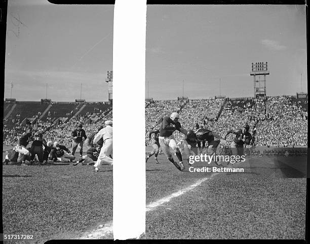 Sammy Baugh, Washington Redskins , is about to tackle Dave Smukler , Philadelphia Eagles, as the Redskins beat the Eagles, 7-0, in a National...