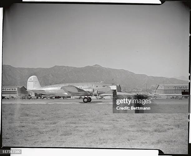 With customary secrecy, Howard Hughes, millionaire oilman and speed flier, is reported to be grooming his new $250 four-motored, streamlined...