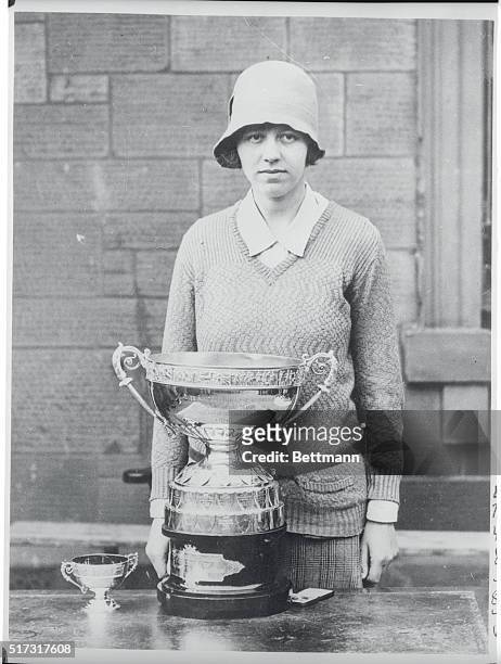 Winner of Women's Open Golf Championship. London, England: Miss Joyce Wethered with cup when she beat Glenna Collett of U.S. For Women's Open golf...