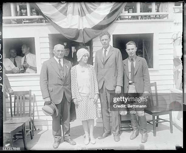 Photo shows L.W. Greve, race President, Mrs. And Colonel Charles A. Lindbergh and Cliff Henderson, race manager as they appeared at the Cleveland Air...