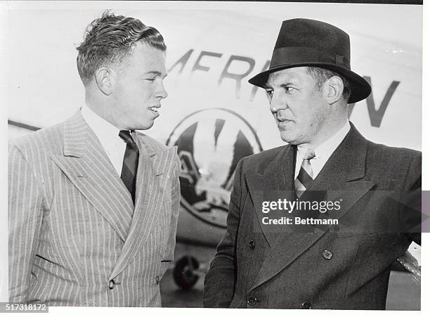 Billy Patterson , former Baylor University quarterback, with Red Grange, assistant coach of the Chicago Bears as Patterson arrived form Waco, Texas....