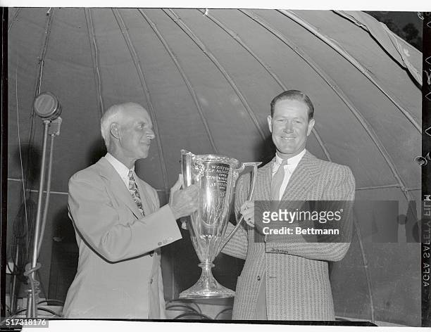 Byron Nelson, of Reading, Pennsylvania , receiving the trophy from Leslie Cooke, president of the Western Golf Association, after winning the Western...