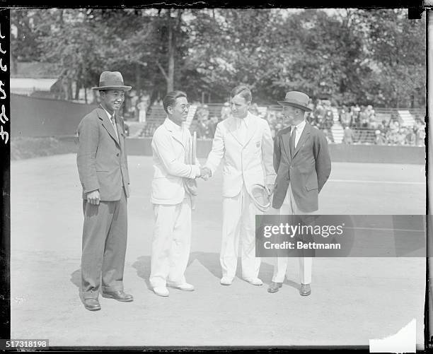 Dixon group. U.S. Wins first day's matches with Japan in Davis Cup Play Washington D.C.. Left to right, Yoshira Ohta, Captain of Japanese Davis cup...