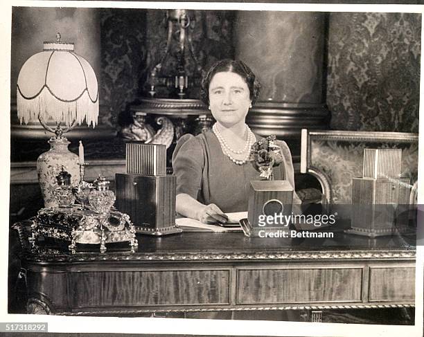 London, England- Queen Elizabeth, shown before a microphone in Buckingham Palace, London, as she broadcast a message to women on the 21st anniversary...