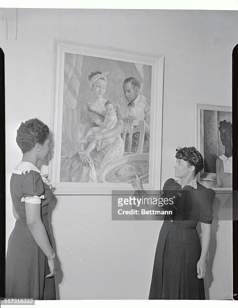 Dorothy Sutton and Frances Taylor Mosely admiring painting of American Family by James A. Porter, of Howard university, Washington, DC, Exhibited at...