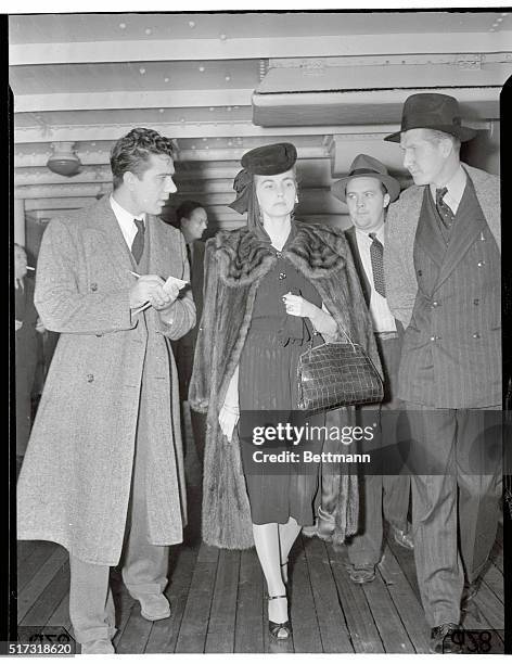 New York, New York: Countess "Babs" Back. Countess Barbara Hutton Haugwitz-Reventlow, answering questions of reporters aboard the S. S. Conte Di...