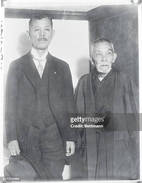 Japan: Two Japanese presented a United Japanese front at Geneva-Tokyo, Japan; Baron Riejiro Wakatsuki, left, head of the government, calls on the...