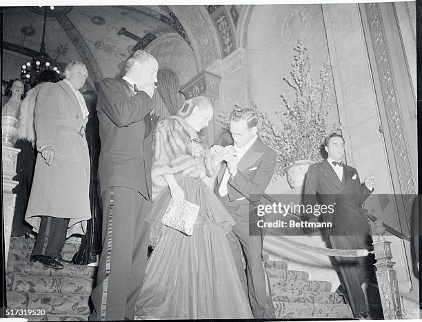 Bette Davis, who had won a few Oscars herself, is shown with her husband, Arthur Farnsworth, , and John Favor, who is doing one for Bette, by...